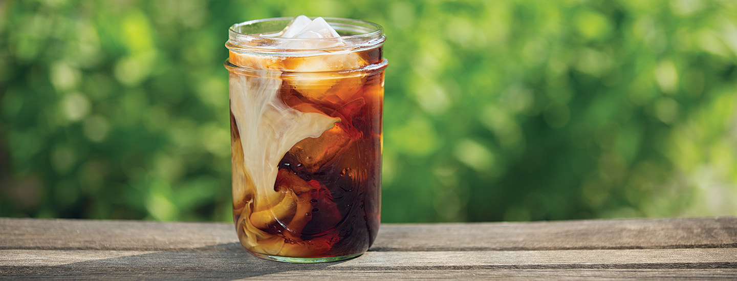Cold brew in mason jar with milk and ice